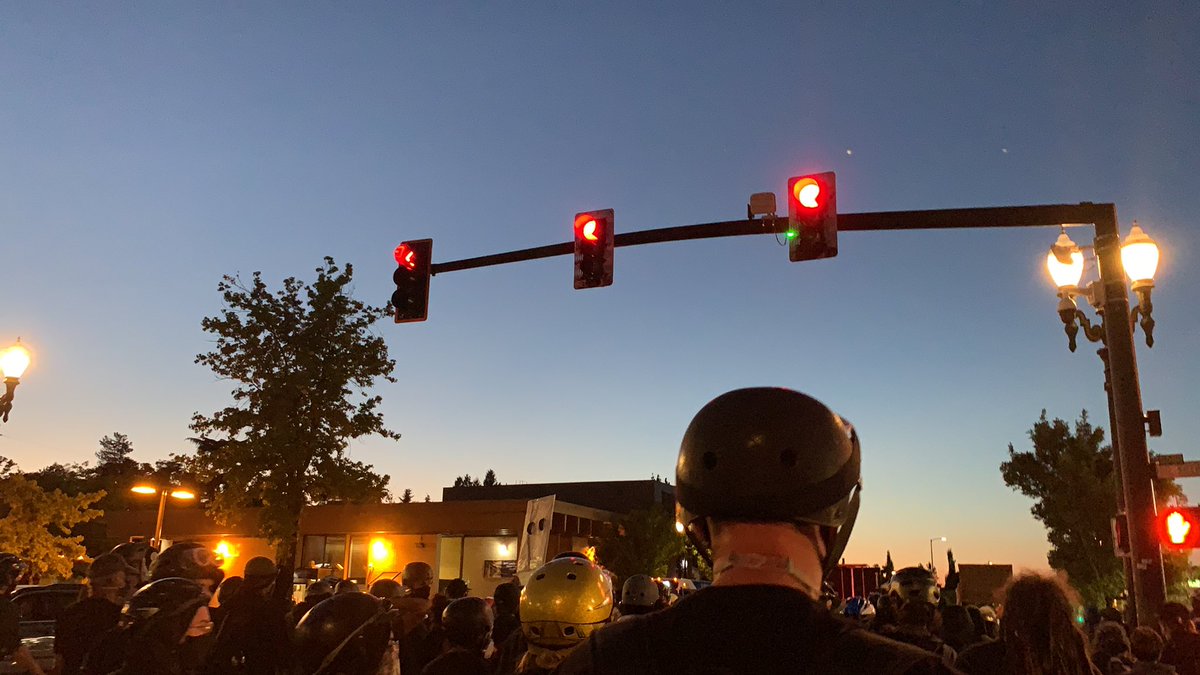 Crowd has stopped briefly on NE Killingsworth. Someone jokes we are stopped at the red light. Crowd now moving north again.This is exactly where “hello, hello” happened, I just want you to know.