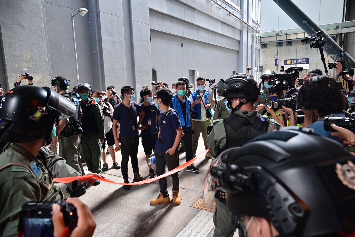 galileocheng's tweet photo. Police just announced district councilors violating Cap 599G prohibition of group gathering and cordoned the area before a small march to protest against police misjudgment in last year’s July 21st asssult in Yuen Long West Rail Station #Hongkongprotests https://t.co/gq53PaKMcO
