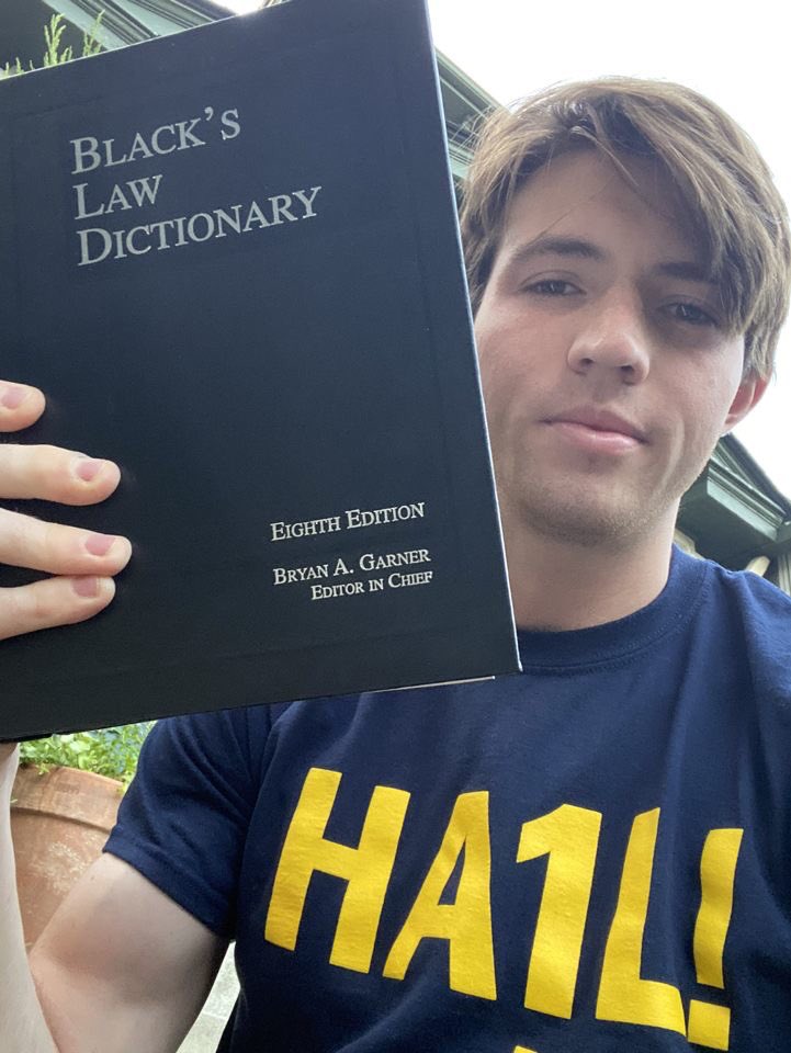 liv_torres's tweet photo. Alex ran a mile holding this law dictionary, I’m just brimming with jealousy over his shirt. The quest for victory continues! #SALSAW https://t.co/zi2zUGTOC2