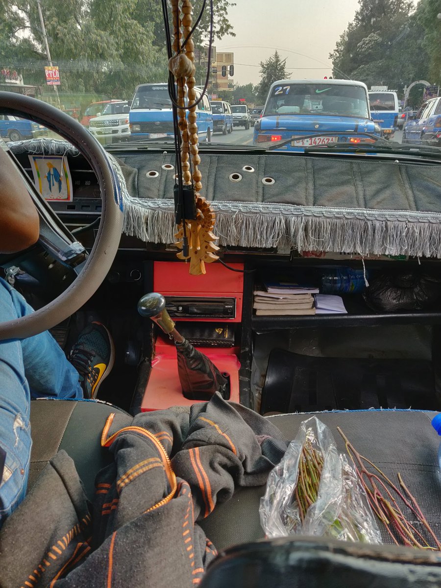 The blue Taxi is Addis signature way to get around other than public roads. Cars are really really really expensive in this country so almost all cars are these classics. when I got in found the driver chewing Khat and was immediately happy and started talking