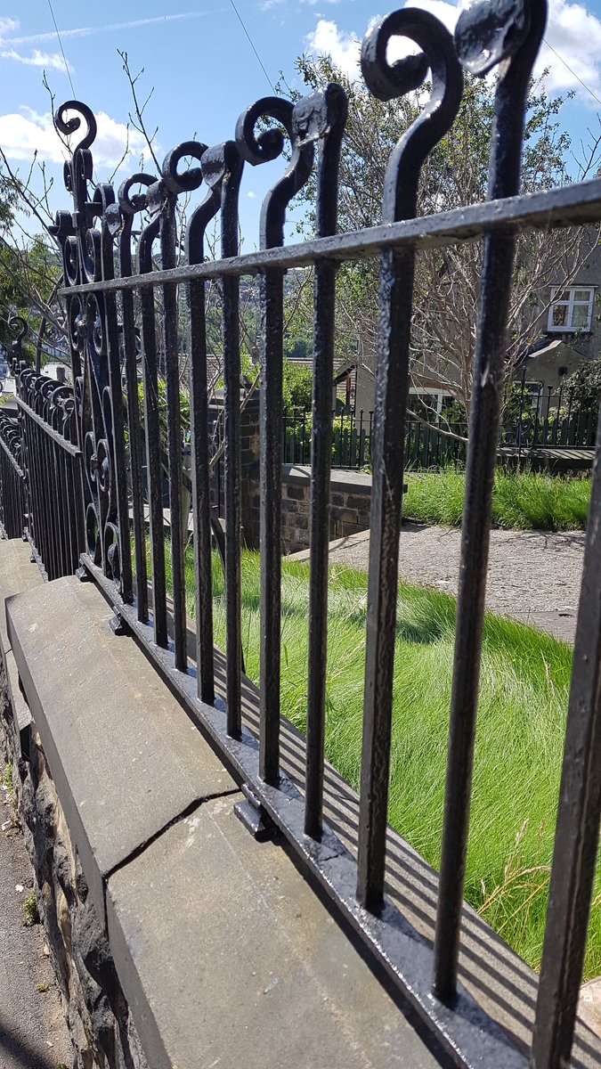 a couple more pics of unchopped original iron railings, this time with a bit of blue sky