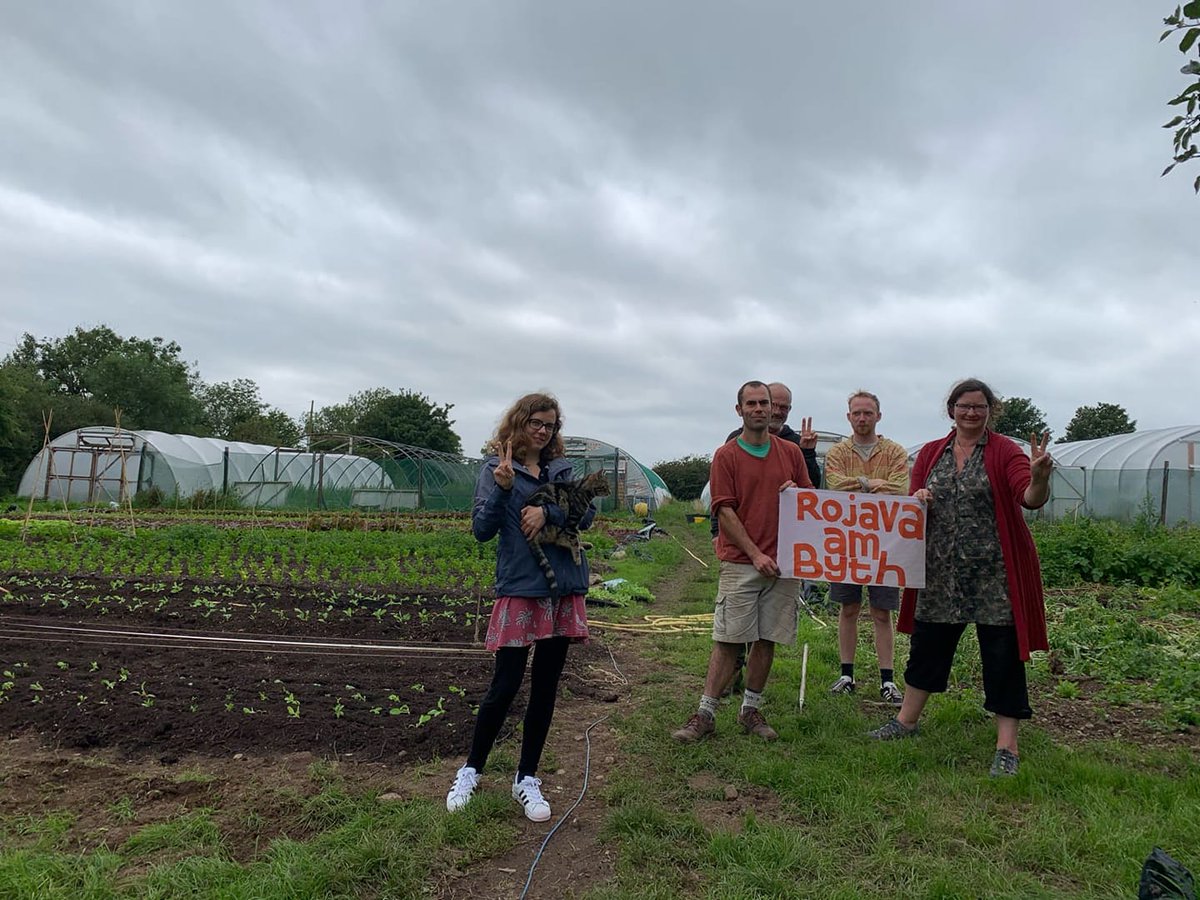 CoopMesopotamia's tweet photo. Tyddn Teg permaculture co-operative in North Wales shared this picture today in solidarity with #Rojava on the 8 year anniversary of the start of the ecological, feminist and co-operative revolution in North-East Syria

#CoopsRiseUp4Rojava #coops https://t.co/6xX4LZpVCL