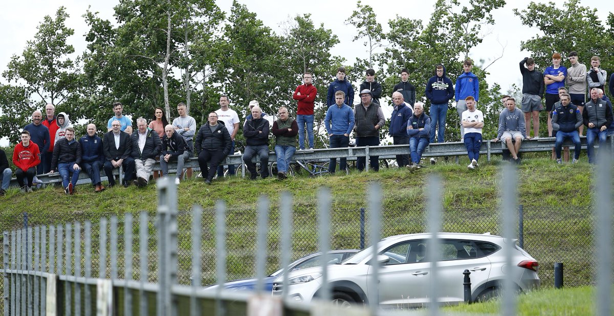 irishnewssport's tweet photo. In tomorrow's Irish News daily paper and on https://t.co/FMshzDOjCK: Supporters watch on from a distance as @MagheryGAC edge past @crossrangers in @Armagh_GAA https://t.co/3YVKotyigP