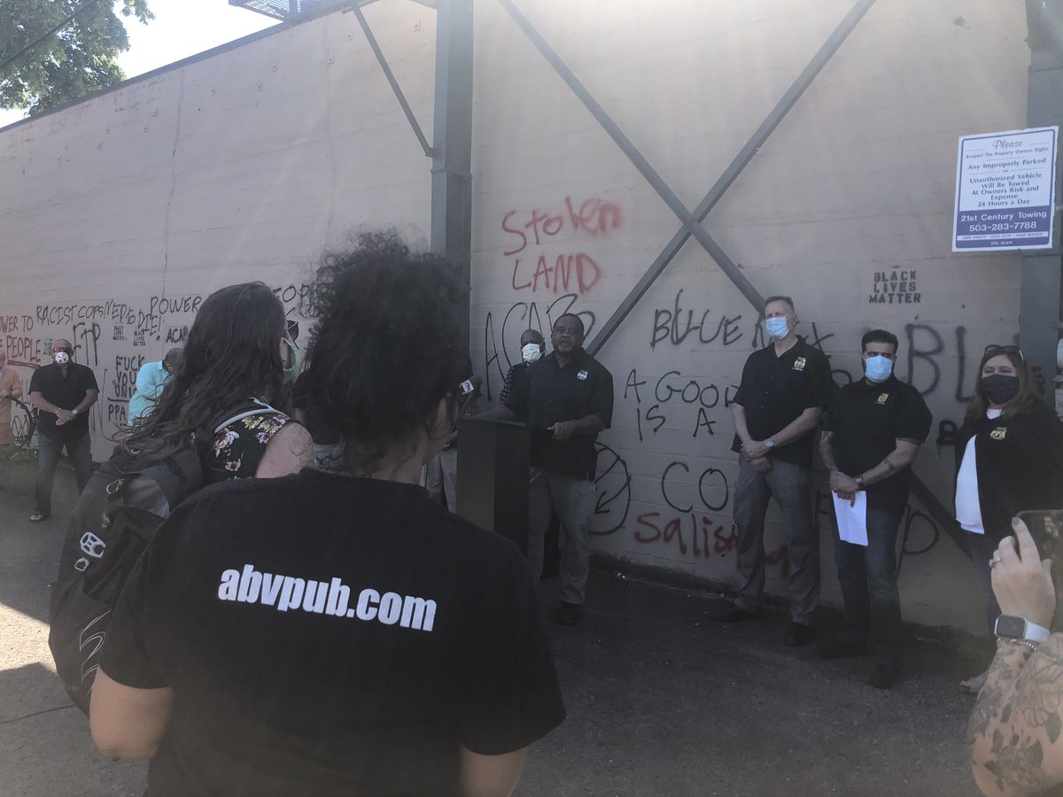 During this, officers tried to get her to quiet down — offering her their cards to talk more later. “No, what go is that going to do? I’m talking about this right now.” Here she is (in abvpub shirt) addressing Turner: