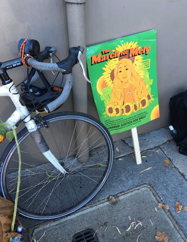 LosFelizLedger's tweet photo. Hundreds of protesters marched to the #SilverLake Trader Joe's today to honor Melyda "Mely" Corado just a few days shy of the two year anniversary of when she was killed by police gunfire in front of the store. #JusticeforMely #MelydaCorado https://t.co/tdprwwGni2