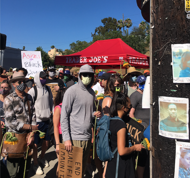 LosFelizLedger's tweet photo. Hundreds of protesters marched to the #SilverLake Trader Joe's today to honor Melyda "Mely" Corado just a few days shy of the two year anniversary of when she was killed by police gunfire in front of the store. #JusticeforMely #MelydaCorado https://t.co/tdprwwGni2