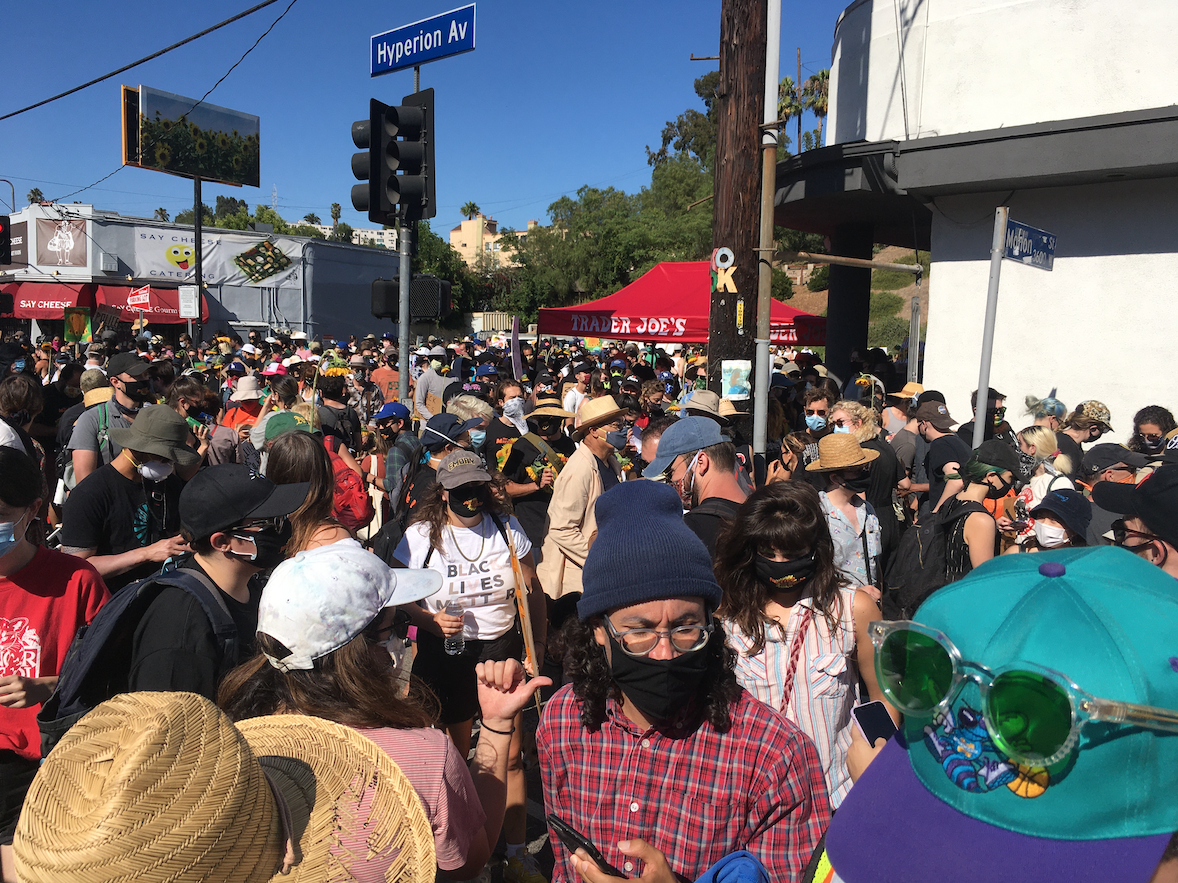 LosFelizLedger's tweet photo. Hundreds of protesters marched to the #SilverLake Trader Joe's today to honor Melyda "Mely" Corado just a few days shy of the two year anniversary of when she was killed by police gunfire in front of the store. #JusticeforMely #MelydaCorado https://t.co/tdprwwGni2
