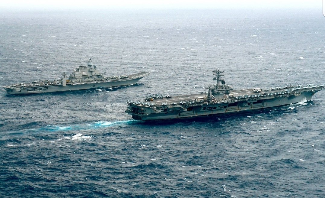 Stroke0fAGenius's tweet photo. Yesterday US Navy's super aircraft carrier USS Nimitz crossed Malacca Straits and reached Indian Ocean.

The best picture of the day -
🇮🇳 INS Vikramaditya sailing along 🇺🇲 USS Nimitz in Indian Ocean.
This pic should be good enough to make the Chinese shake in their boots. https://t.co/wreAb3WJcK