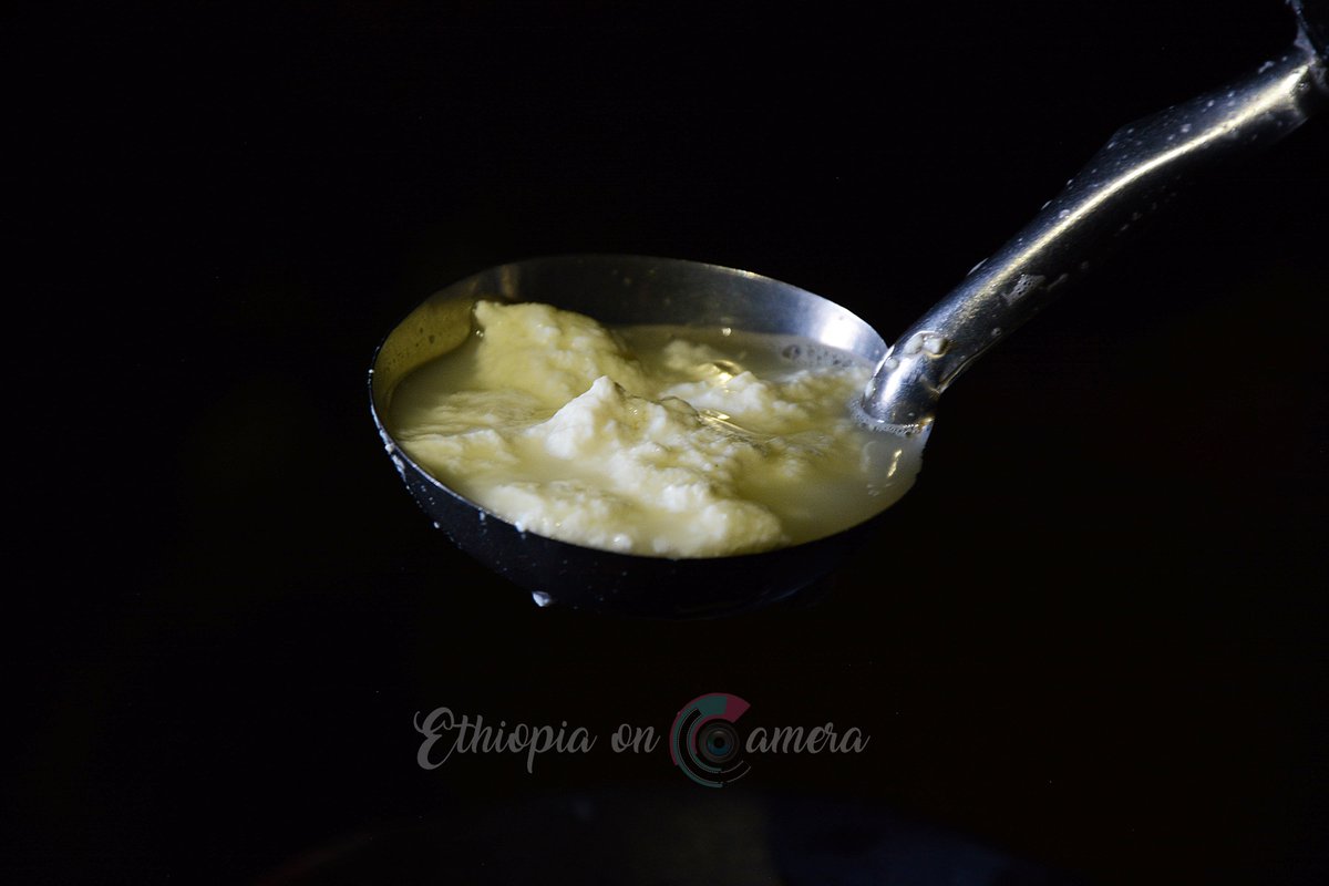 Ethioncamera's tweet photo. #Ayib, a traditional #Ethiopian cottage cheese,  is made from sour milk after the butter is removed by churning. The defatted milk is heated to about 50°C until a distinct curd forms. It is then allowed to cool gradually, and the curd is ladled out or filtered. 
#VisitEthiopia https://t.co/FqqRO5rR5P