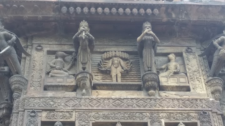 7/712} Celestial fairies Apsaras Sculpture on Durga Temple Ramnagar.13} Miniature sculpture of Ravana and Adi-Varaha Swamy carved on the front of outer roof of the  #Durga  #Temple wall .