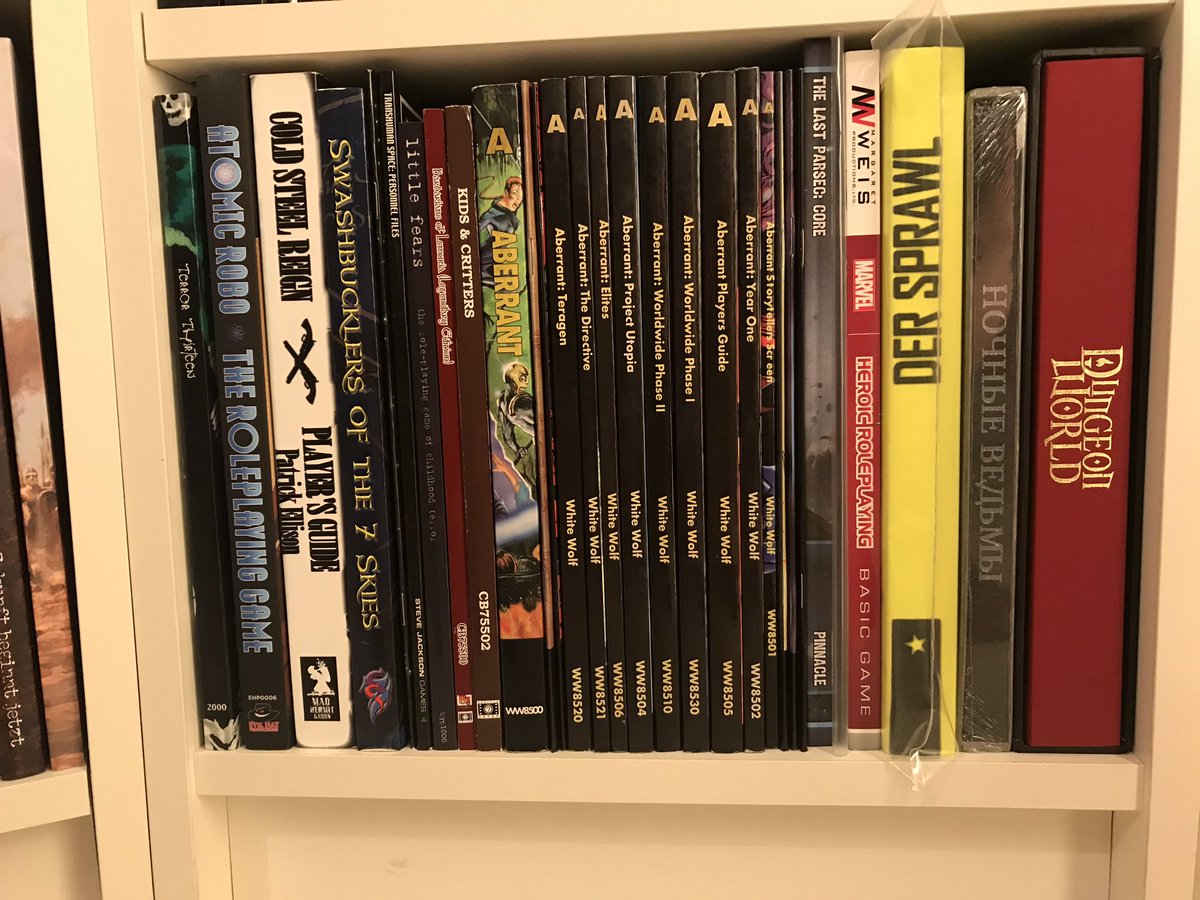 RPGDeluxe's tweet photo. My shelves in detail - Day 45: @SystemMatters @wwpublishing @ProIndie @EvilHatOfficial @PEG_Games @cubicle7 Nice #Aberrant collection, several core rulebooks and sweet Limited Editions #DerSprawl and #DungeonWorld @bullypulpit_hq Korean Deluxe Version of Night Witches https://t.co/lDy2VrqEQj