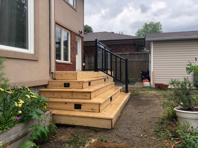 This unique deck installation features glass railings, LED lighting in the stairs &amp; a storage area underneath the deck! It’s been finished in Sansin Wood Sealer. 👍