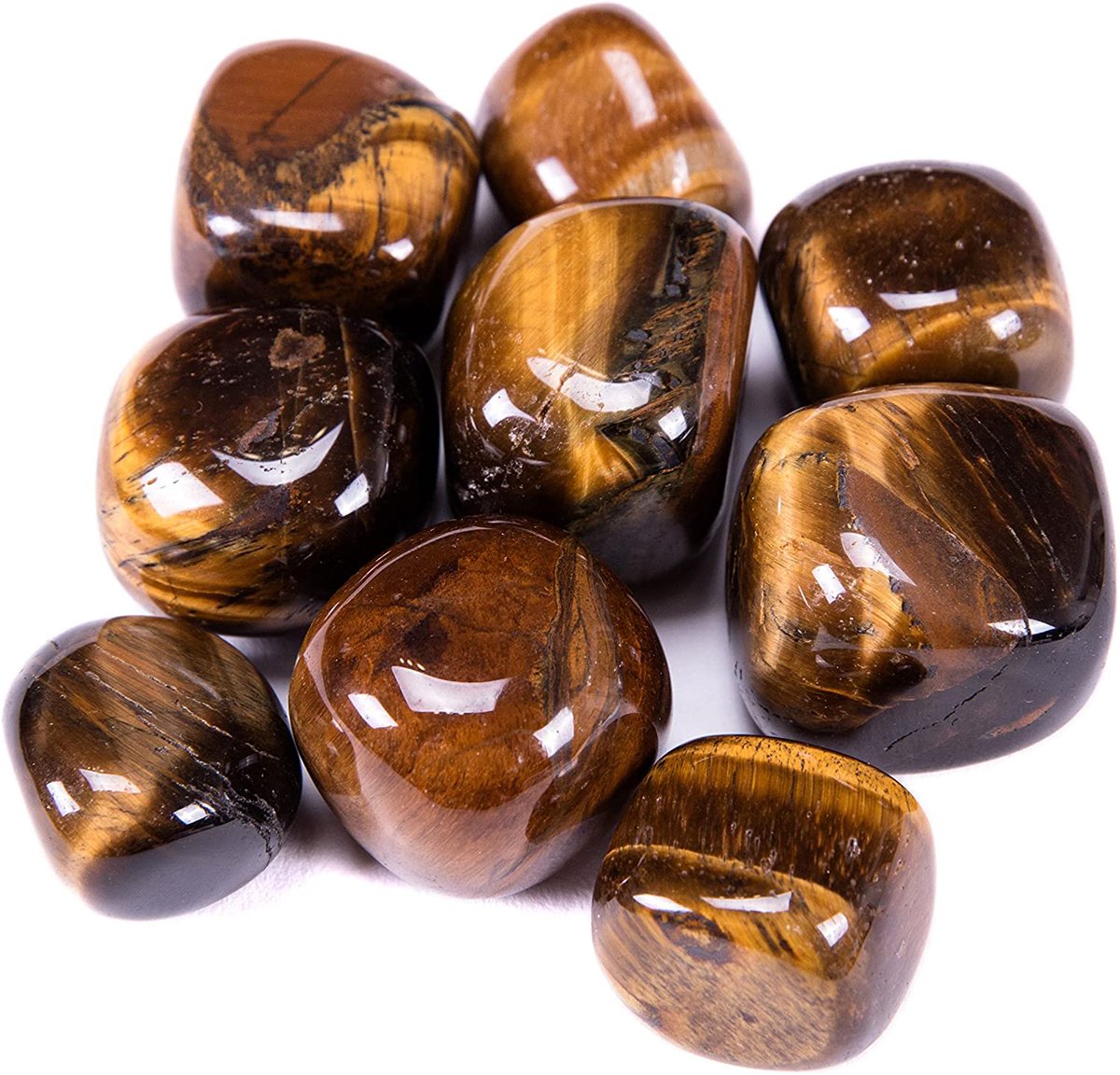 tigers eye - shades & stripes of orange, yellow & dark red/brown - associated with the base chakras and solar plexus- aids in protection against negative energy - also known to help bring good luck - helps to promote vitality and boost determination & courage