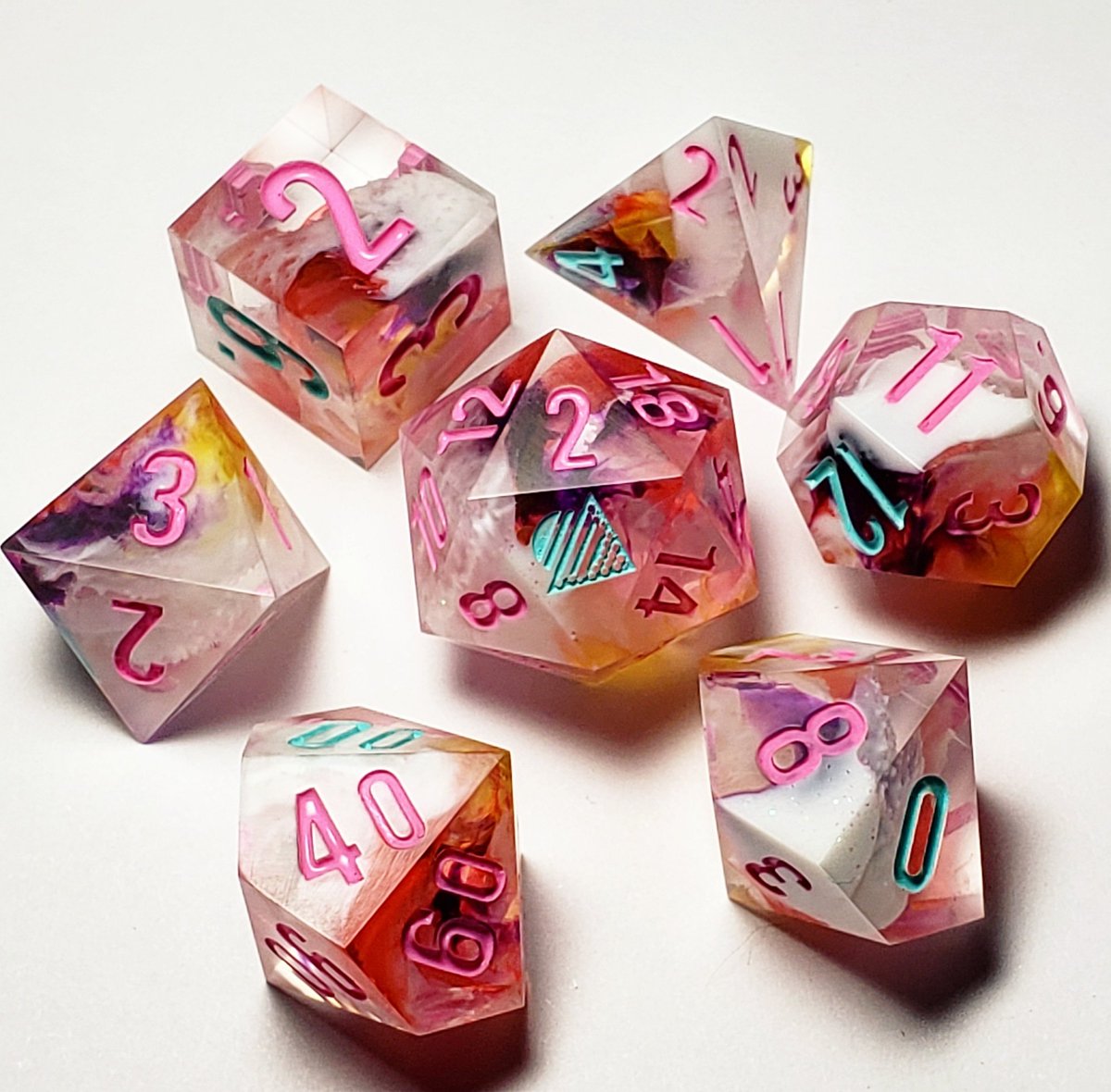 DaybreakDice's tweet photo. A custom set I did a bit ago. I love the colors in these! #dicemaking #dice #custom #resin #art #rpg #dnd #ttrpg #polyhedraldice #resindice #handmadedice #dicecollection #diceporn #resincrafting #customdice #diceset #dicehoard #dicecollector #sharpedgedice #dungeonsanddragons https://t.co/kwPqQHHGep