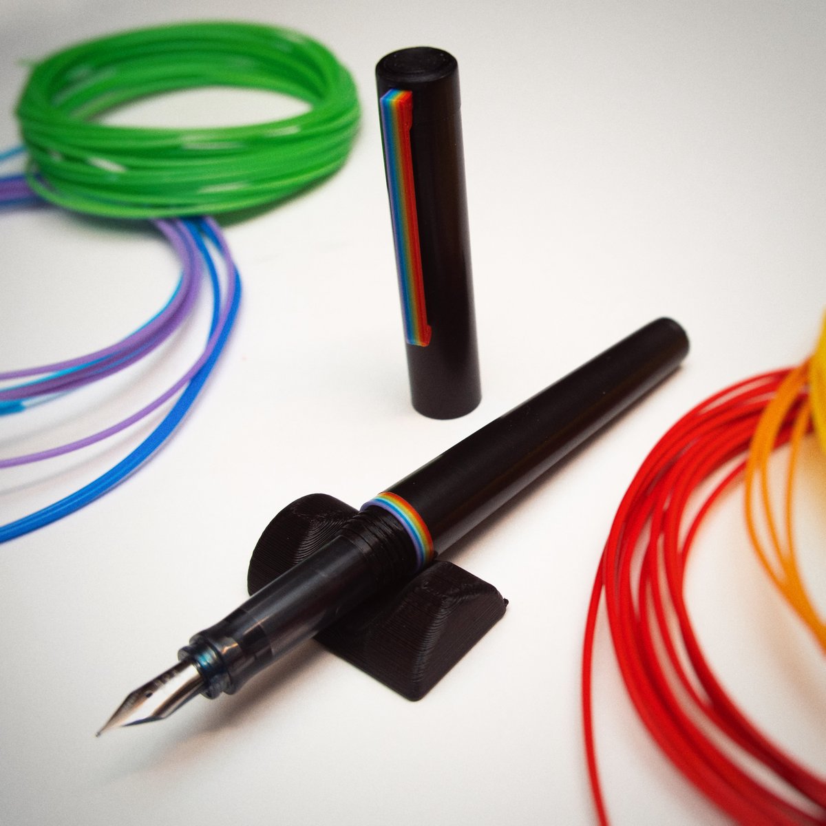 3dprintedpens's tweet photo. New 3D Printed Pen body! 🌈

This one involved a good deal of manual filament swapping but came out awesome, main black parts printed in @3dsolutech premium PLA, performed very well. 

#3Dprinting #fountainpen #penaddict #etsy #stationary #rainbow https://t.co/uKzAK7YHcn