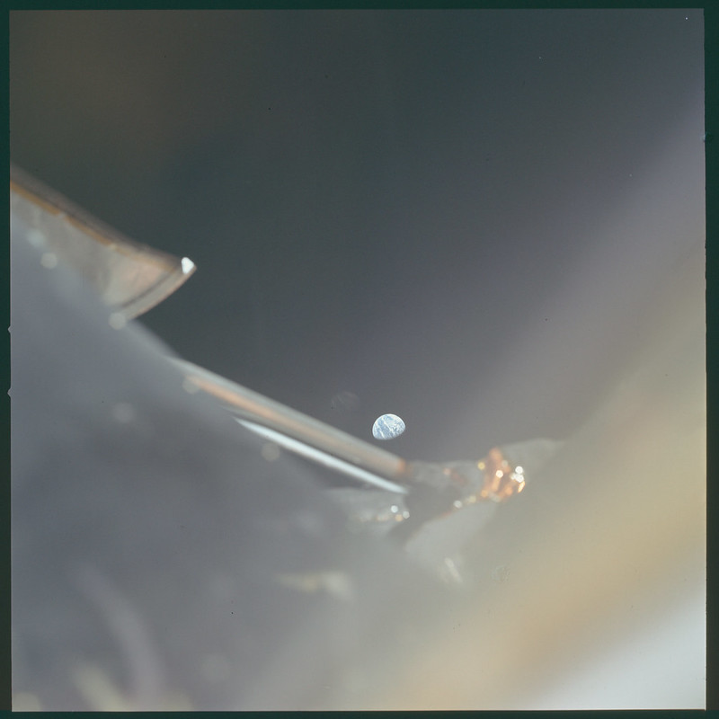I don't think I've ever shared this one but I LOVE IT! The tiny Earth seen over a chunk of what I think is the LM? This pics spot in the magazine suggest it's an LM roll of film. This was taken after the landing as Neil and Buzz went to rejoin Mike in the CSM.  #Apollo11