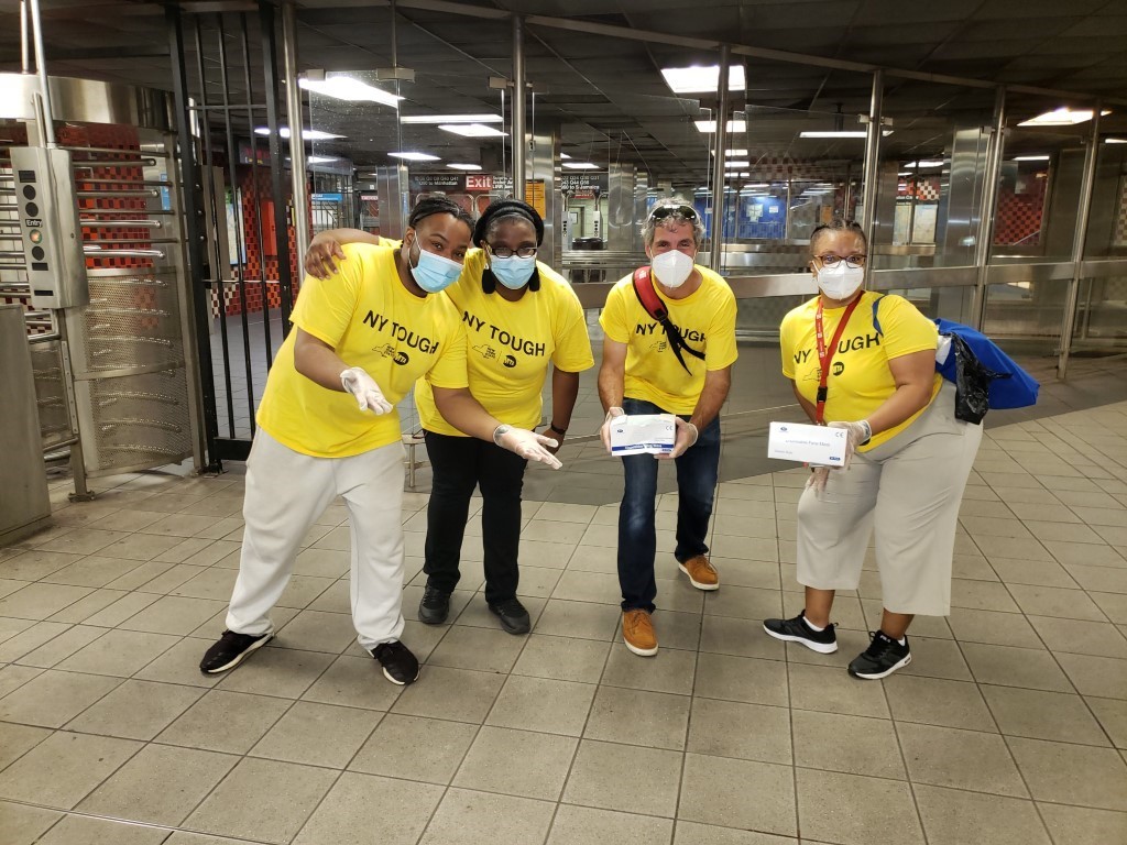 NYCTSubway's tweet photo. 👋 It’s day 1 of Phase 4 and we've been disinfecting 24/7.

We still need you to wear your mask. They're available for free anytime at booths, and starting today volunteers are handing out thousands on subways and buses.

Meet the Mask Force 👇 https://t.co/4l38OkgnVg