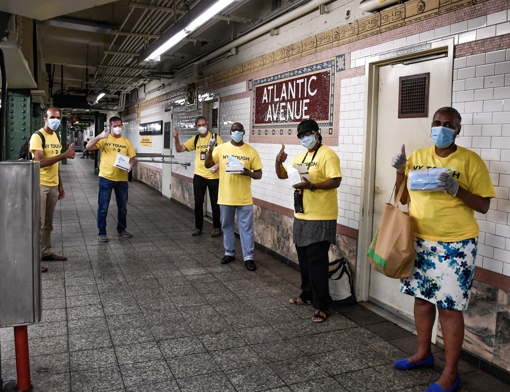 NYCTSubway's tweet photo. 👋 It’s day 1 of Phase 4 and we've been disinfecting 24/7.

We still need you to wear your mask. They're available for free anytime at booths, and starting today volunteers are handing out thousands on subways and buses.

Meet the Mask Force 👇 https://t.co/4l38OkgnVg
