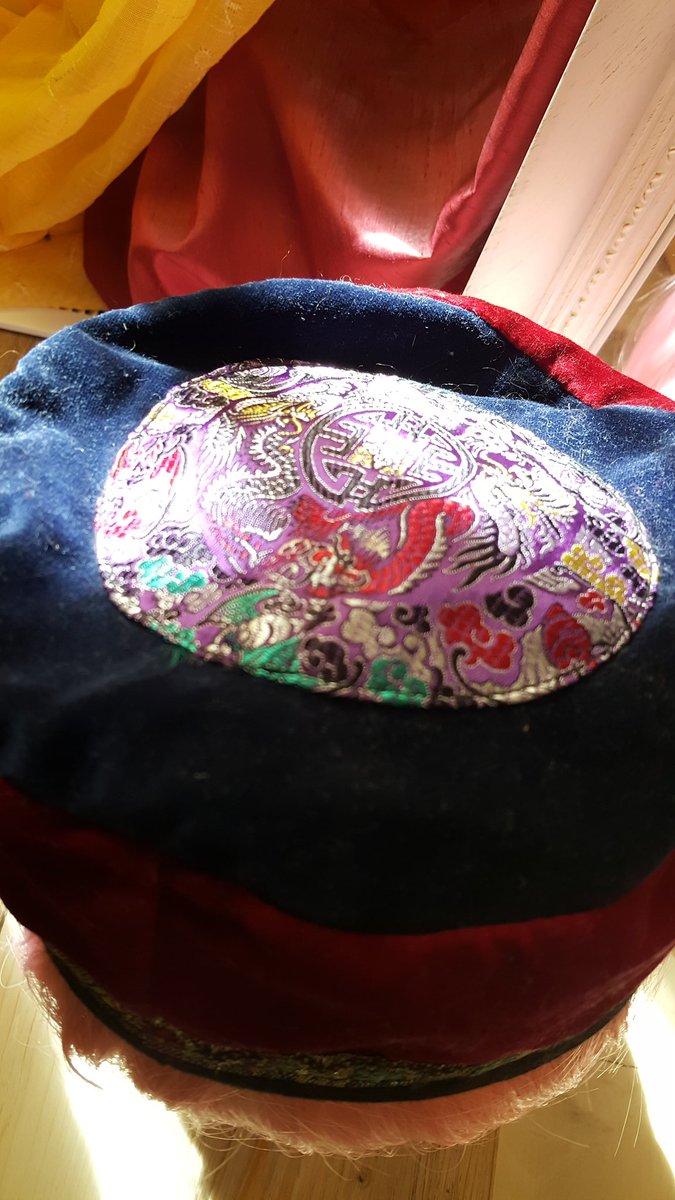 Red velvet brimless hat with shiny embroidered detail. I was wearing this hat the day I proposed to Sig. I bought it at the Festival of Friends in Hamilton ON c. 1995.