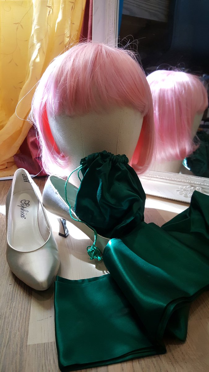 A real find. The green velvet sash and matching drawstring bag from my highschool prom in 1987. My Gramma made me my dream princess ball gown in deep green satin that looked great with my long red hair. Satin shoes from a bridesmaid dress, c 1996.