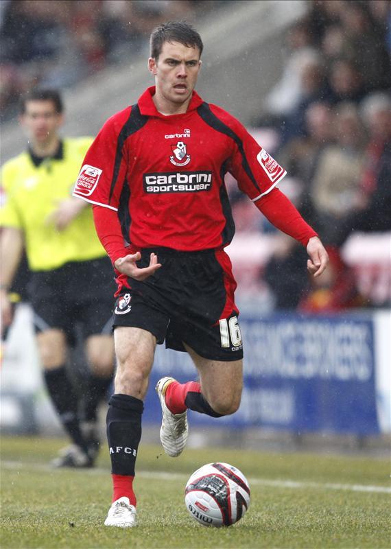 Next up Rhoys Wiggins, the left back has been signed 4 times by Howe, twice on loan. Promotion from League 2 led to a free transfer from Norwich. He starred in the Cherries play off push in 2011 and a transfer to Championship Charlton for £200,000 followed. Retired due to injury.