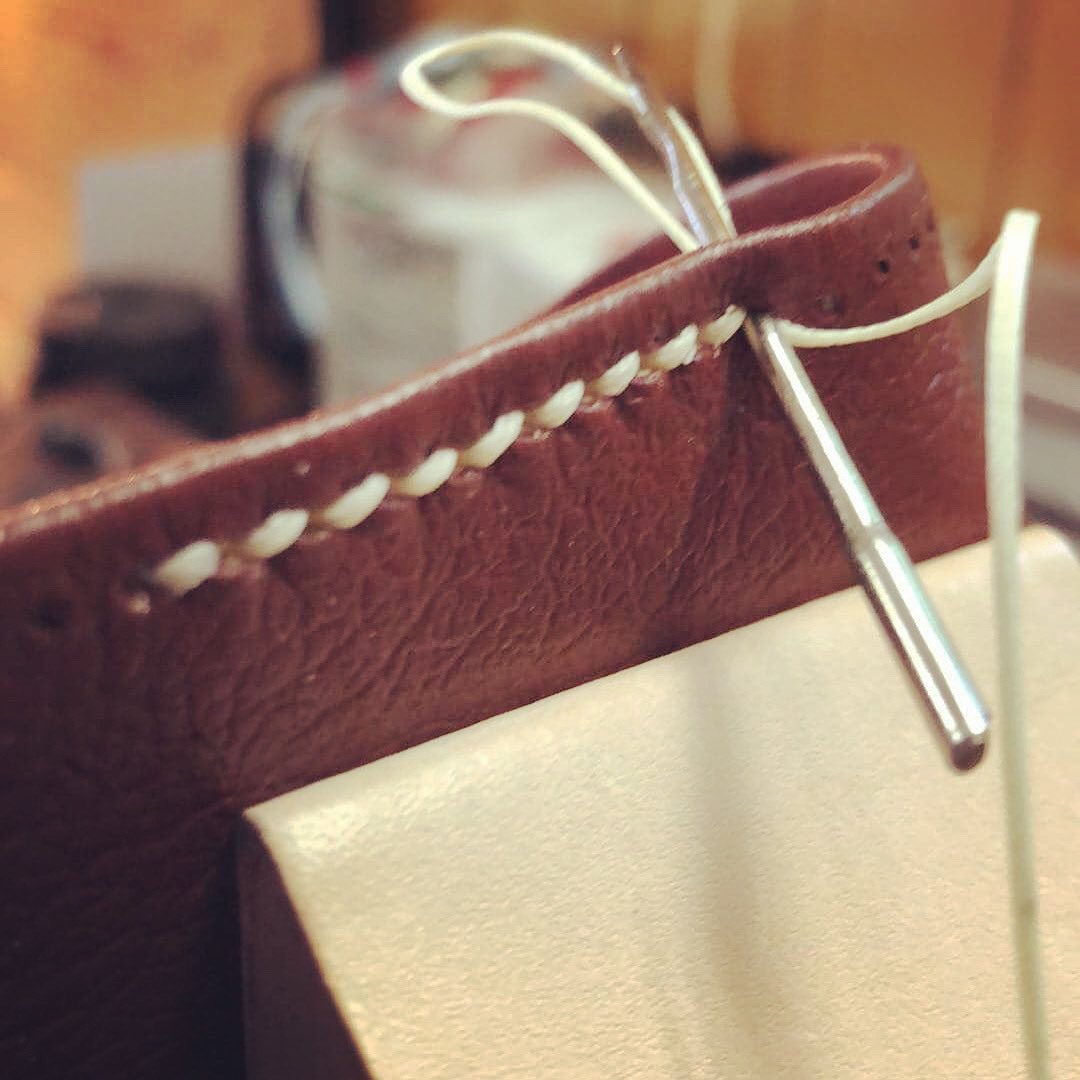 alexgarnerccbc's tweet photo. Working on a Bible rebind. Cream tiger thread going through some crimson river grain goatskin. #rebinding #bibles https://t.co/YjiEgwl0Ek