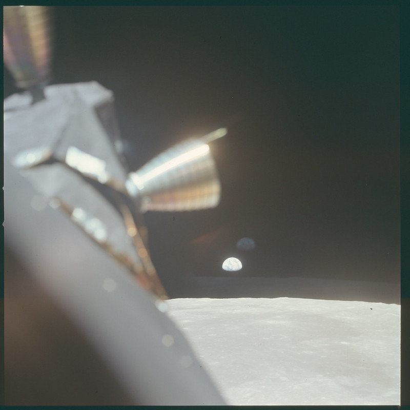 Another shot taken in lunar orbit after  #Apollo11 landed on the Moon. Earthrise with a healthy amount of LM ascent stage thruster in the foreground, and of course the lunar horizon!