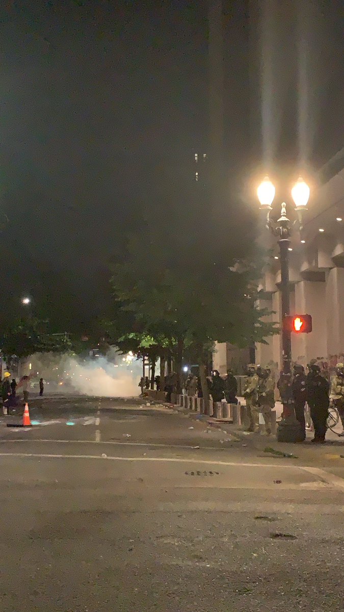 Line of shields advanced again! Looks like there’s also a lot going on over on 3rd and salmon, a block north. (That’s where the cloud of gas is in the background. There are feds lined up in the foreground.)