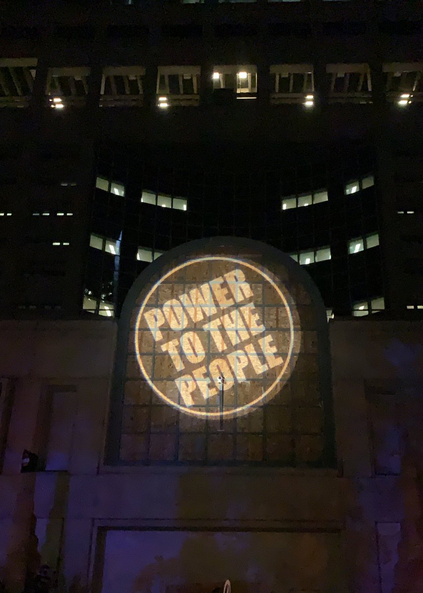 The projection on the wall of the JC is done by a few older protesters who are part of a group called PEST, and the first person to remind me what that stands for gets a prize! They’re currently projecting the words “power to the people.”
