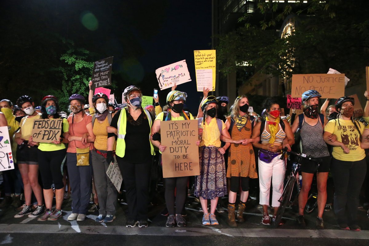 Many moms were part of tonight's protest in downtown Portland. The crowd marched to Pioneer Courthouse Square, then headed back to the Justice Center. (photos by  @bethnakamura)