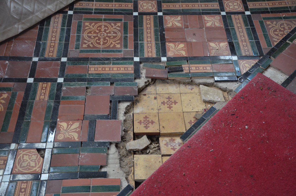 However, as the building continues to shift due to structural movement, cracks in the floor have revealed a previous layer of tiles - also Victorian - but in a simpler style.3/4