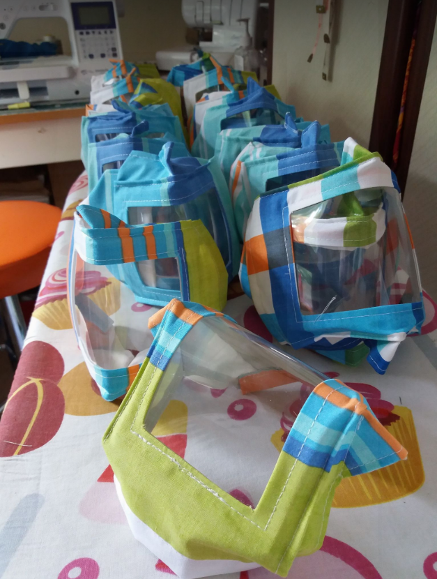 grace0051's tweet photo. .Wearing my lipreading mask I made for the Hospital at home team. I made a mini version for my memento teddy who is also wearing tiny scrubs and head band with buttons to protect his ears. @paddygrant :) @bigcommunitysew @visitbanbury https://t.co/3O7JLkujnB
