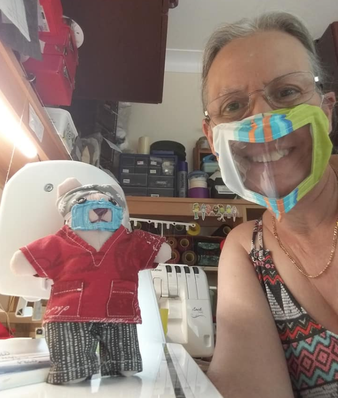 grace0051's tweet photo. .Wearing my lipreading mask I made for the Hospital at home team. I made a mini version for my memento teddy who is also wearing tiny scrubs and head band with buttons to protect his ears. @paddygrant :) @bigcommunitysew @visitbanbury https://t.co/3O7JLkujnB