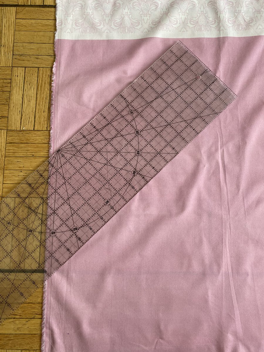 Find the bias (if you have a quilting rule it is super easy as it has angles printed on it!) and mark off your line. Then keep tracing off lines until you cross the entire bottom. I am doing 1/2” wide bias for this, so I marked off 2” wide sections to fold down.