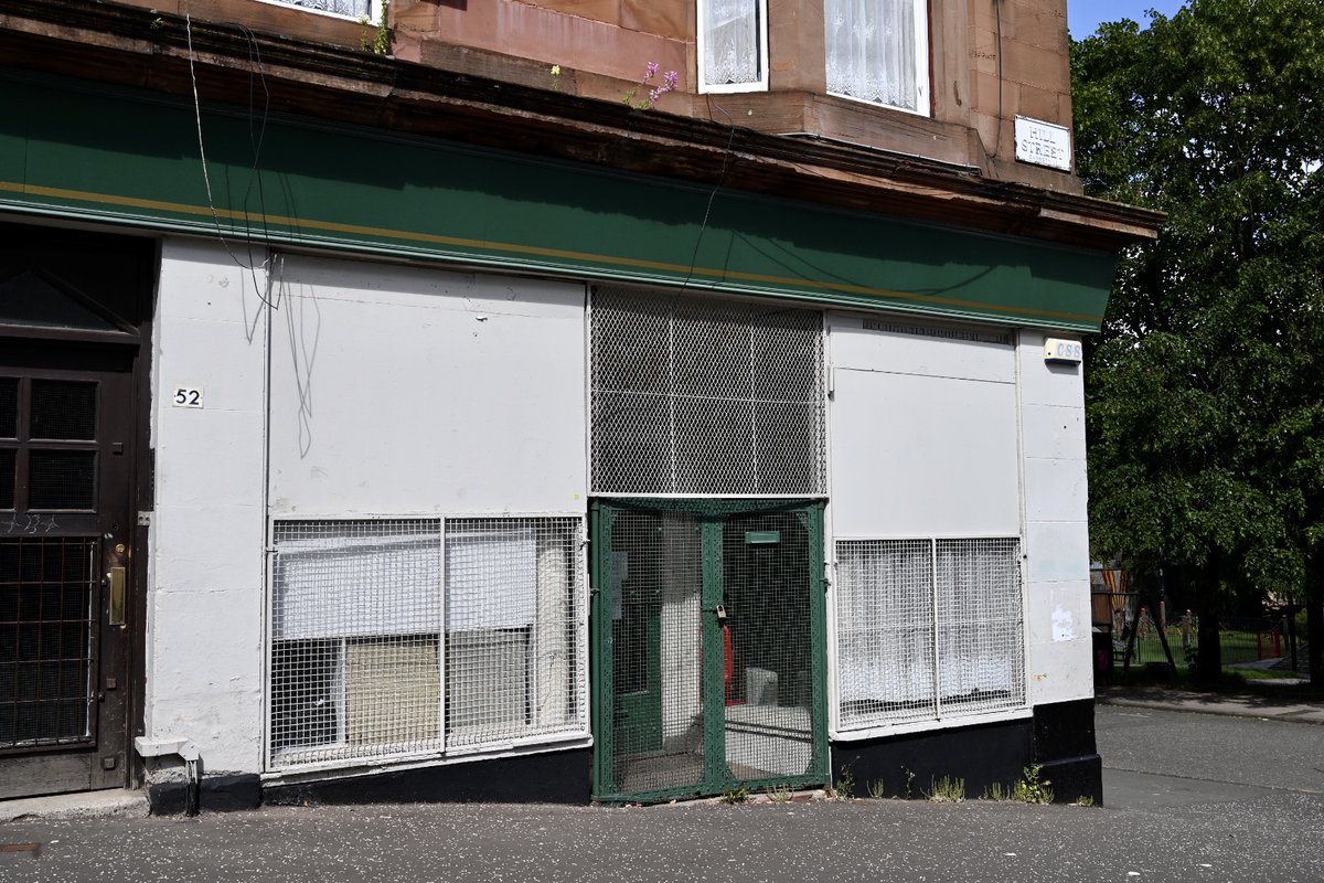 Front view of the shop on a steep corner, this time with the