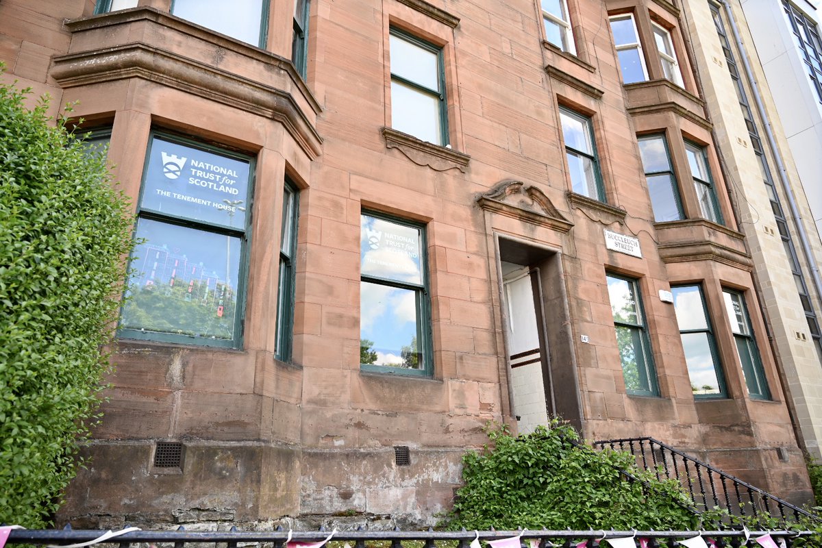 Red sandstone tenement building with stairs leading to the d