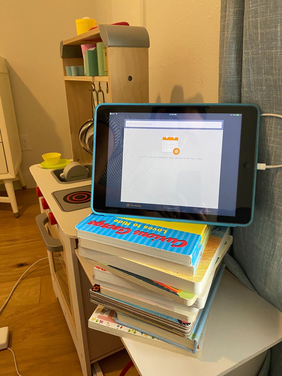 meeksmktg's tweet photo. Our work-from-home office space continues to evolve. Sometimes the only quiet, logical spot for a virtual meeting is on top of your toddler's play kitchen with your device propped up on board books. Who can relate?
#WFH #virtualmeeting #marketing #AEC #AECTexas https://t.co/RH9qIbqM2h