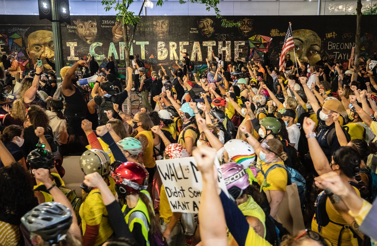 The march wound around downtown, passing by the George Floyd mural for a moment of silence.