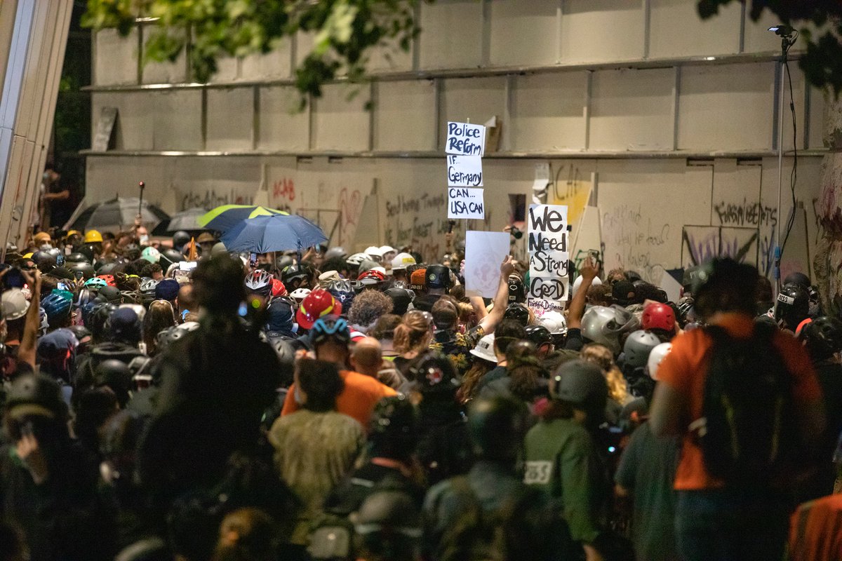 After the march, the crowds thinned a little and protesters converged on the courthouse. Some blocked the makeshift openings that LE officers use to shoot out crowd control munitions. Others tore off pieces of plywood (there’s a video posted earlier on my timeline).