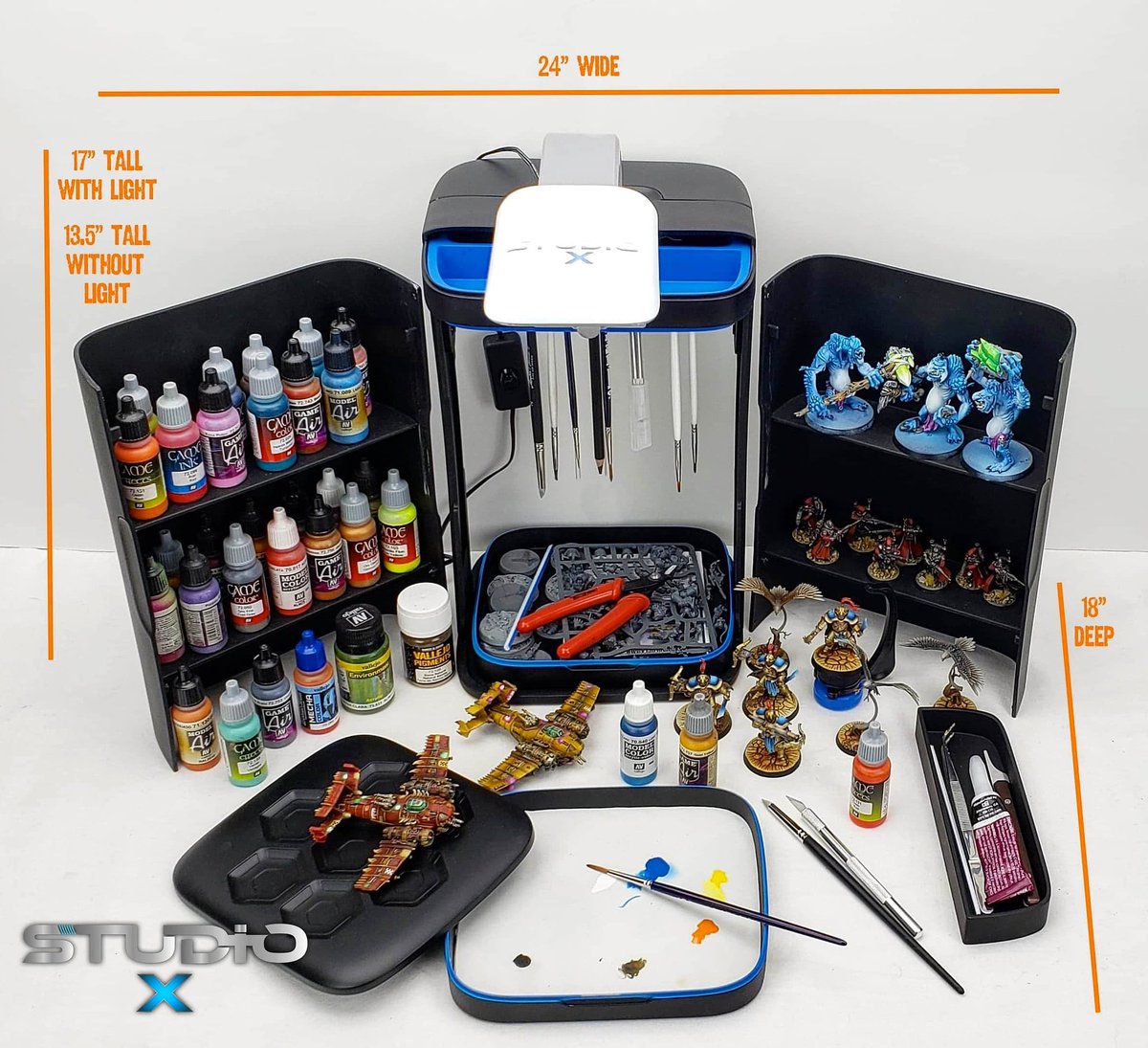 Studio X is designed for the miniature artist on the go or with limited space. Opened up it takes 24 inches x 18 inches of work area and its 17 inches to the top of the LED light. Its extremely easy to pack up and roll out. 
kickstarter.com/projects/92591… #minimasterwerks #studiox