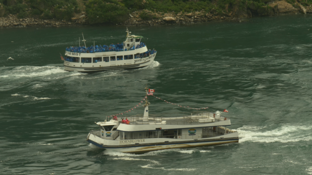 CTVNews's tweet photo. Canadian, American tour boats at Niagara Falls become symbol of COVID-19 contrast https://t.co/NnBReGj1Vo https://t.co/BjiOp1NW2o