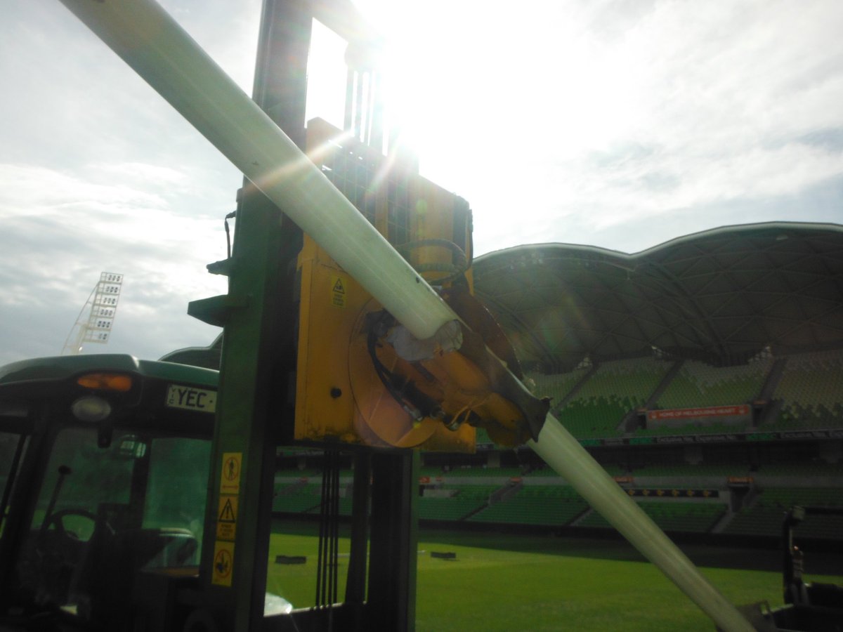 STRI_Australia's tweet photo. Equipment innovation is a great thing! To install the rugby posts at AAMI Park, Justin Lang & team use a machine that grabs the post horizontally from a trailer, then lifts it high into the air, rotates the post vertically and fits the post into the ground. #STRIgroup #STRIaus https://t.co/zbt3kK1rWW