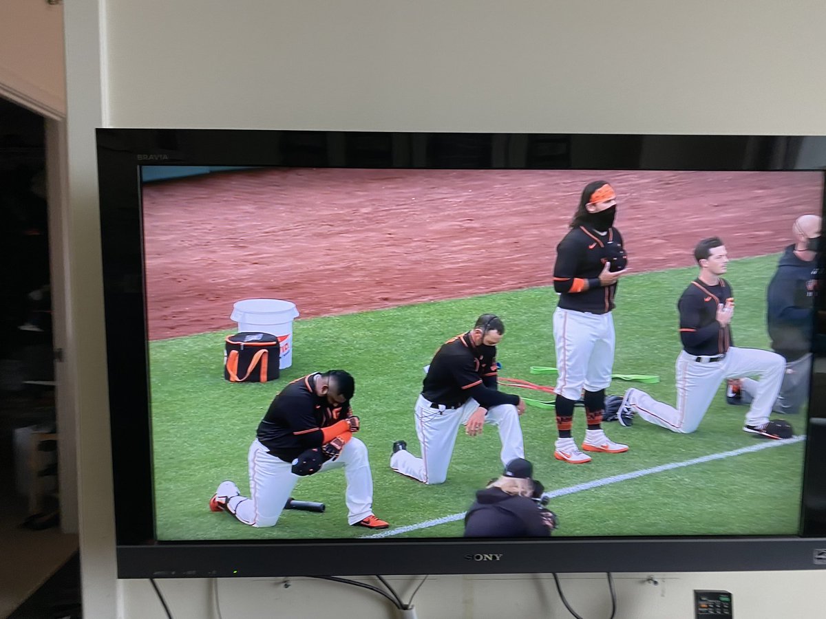 carmenkiew's tweet photo. Hunter Pence and Pablo Sandoval kneeling during the anthem. Couldn’t be prouder. #BlackLivesMatter https://t.co/nGHIw6oXpu