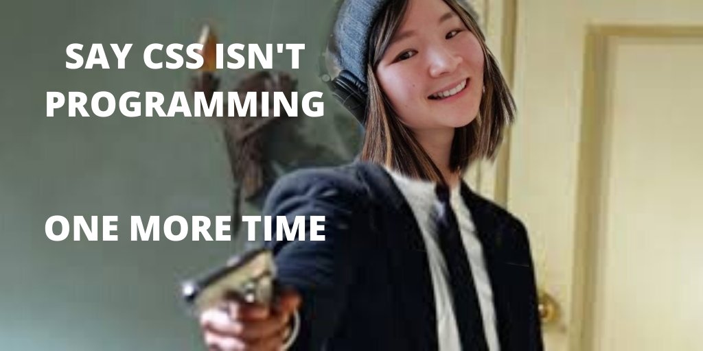 Annie in a suit, smiling and pointing a gun at the camera. Text is "Say CSS isn't programming one more time" 