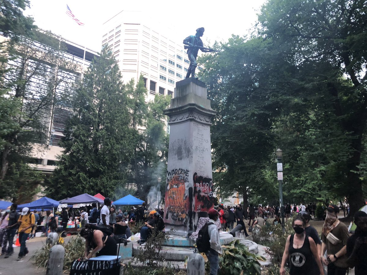 Checking in from Lownsdale Square in downtown Portland, where hundreds are gathered yet again and these community minded folks have free helmets on offer for anyone who wants head protection.