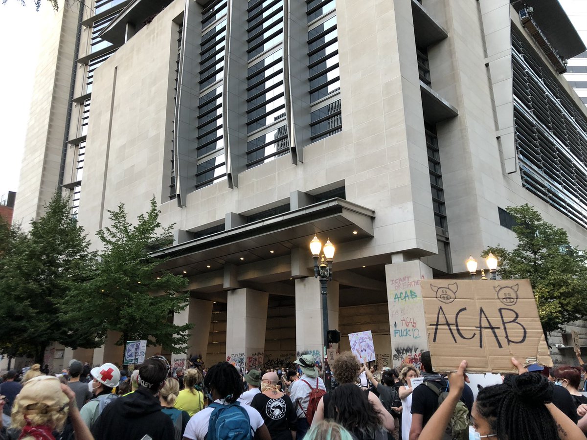 Checking in from Lownsdale Square in downtown Portland, where hundreds are gathered yet again and these community minded folks have free helmets on offer for anyone who wants head protection.