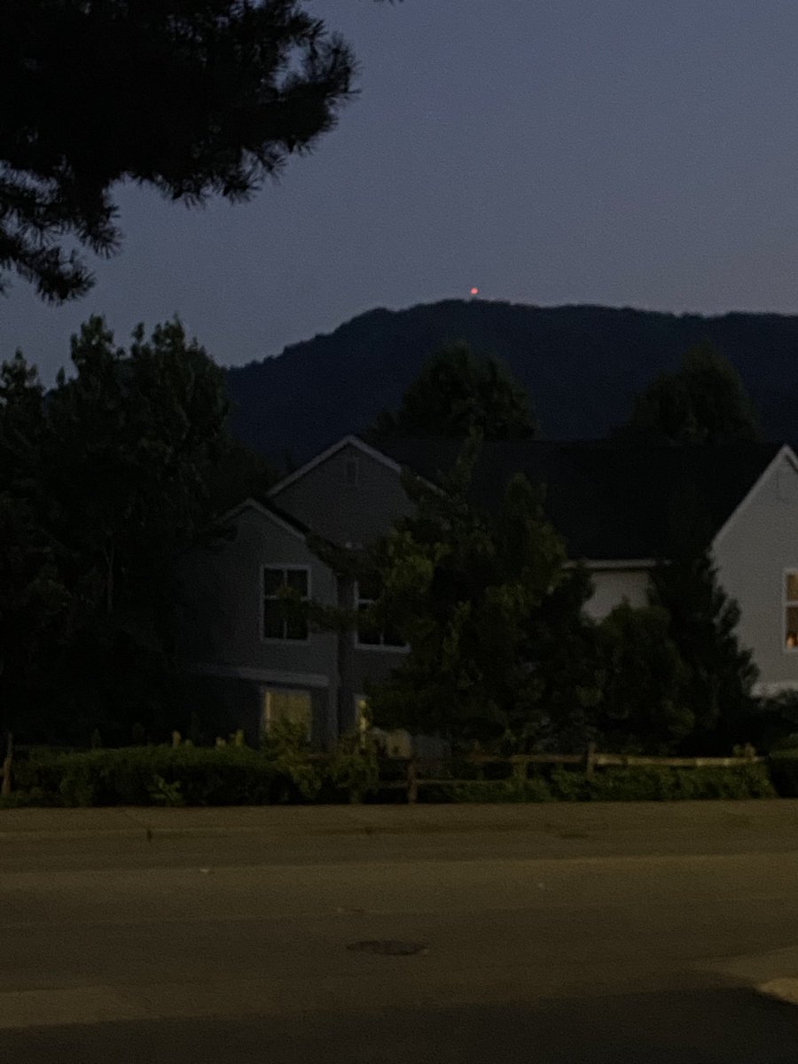 Red light on the mountain. 

It’s some tower up there