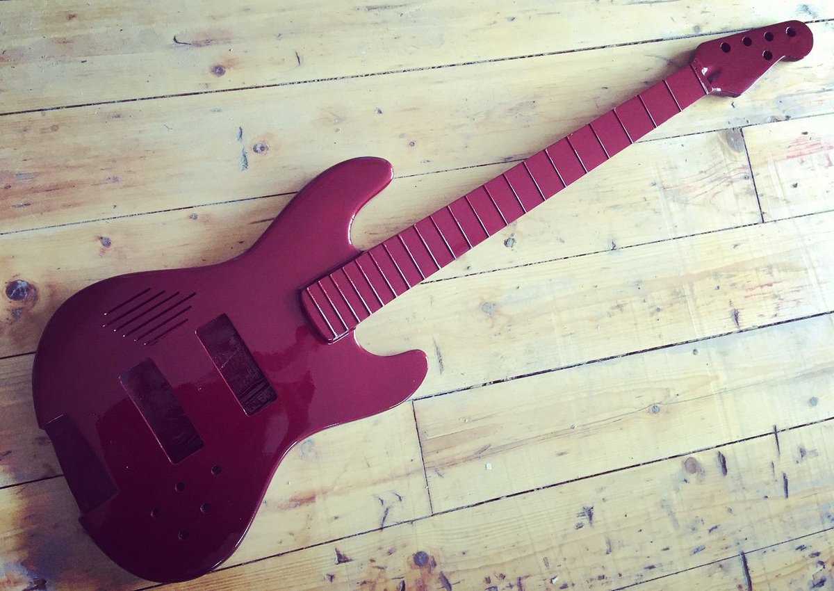 GHServices's tweet photo. This #BassLab SOUL 5-string bass is painted in a deep pearl red. Looking almost burgundy in this photo, it reacts with red highlights under bright light. #bass #electricbass #bassguitar #hollowbody #carbon #composite #carbonfibre #carbonfiber #5stringbass #5string https://t.co/xCWf8V7V8n