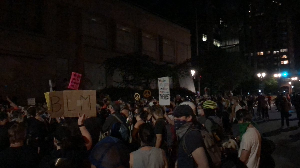 But a half block away, hundreds are still chanting in opposition to police violence and racism.