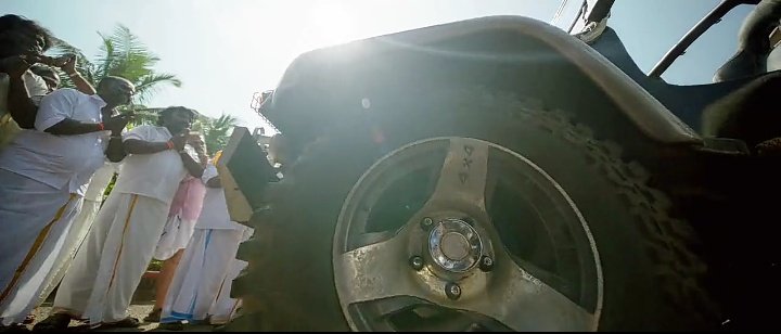 After the focus on left wheel, the back of the man with much respect is shown.. 